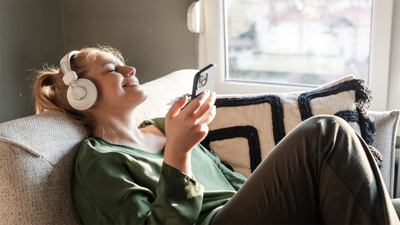 Woman with headphones on listening to music
