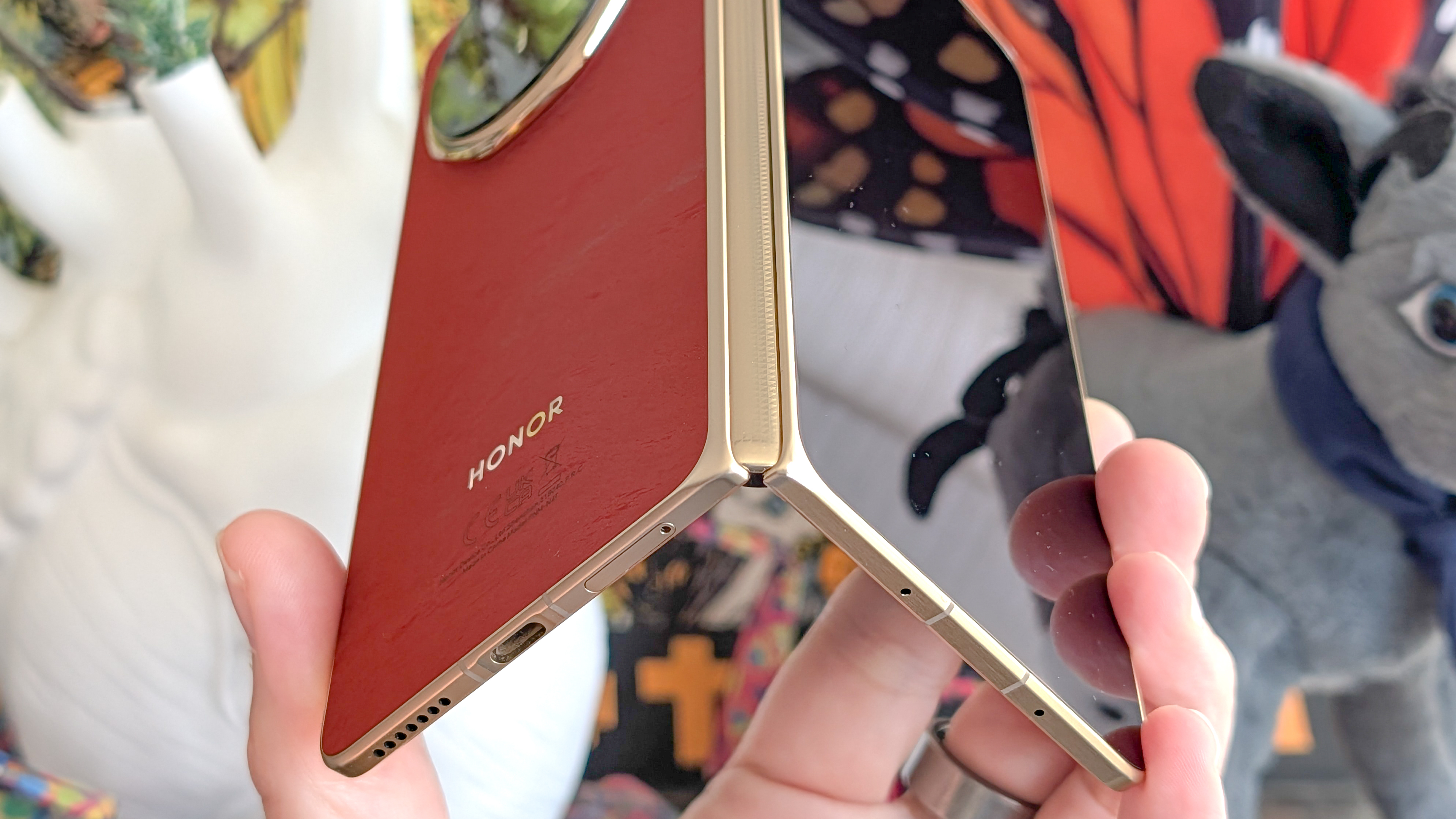 Oppo Find N6 and Honor Magic V6 held in the hand.