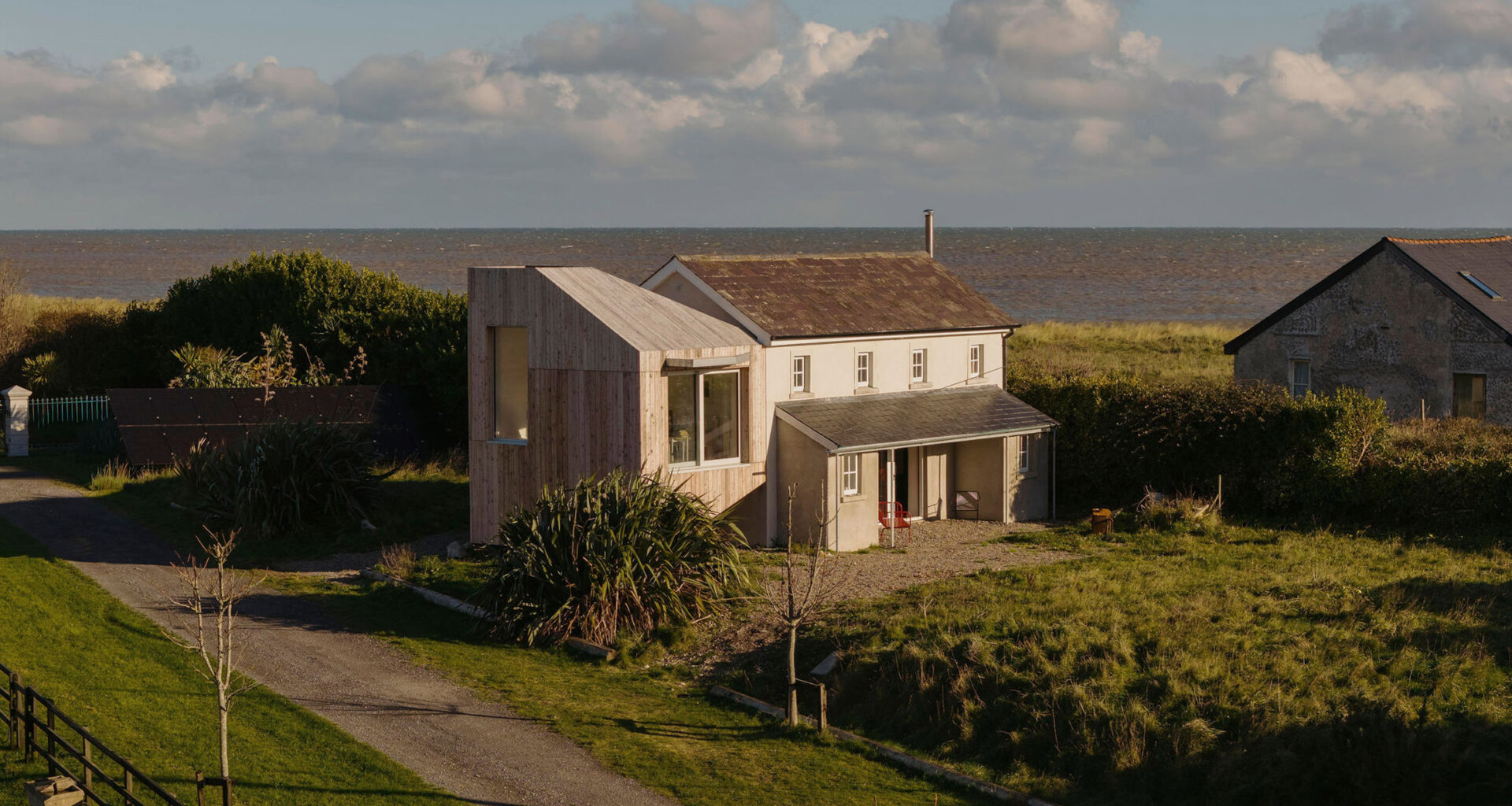Bird hides inform Seagull Cottage extension by Architectural Farm