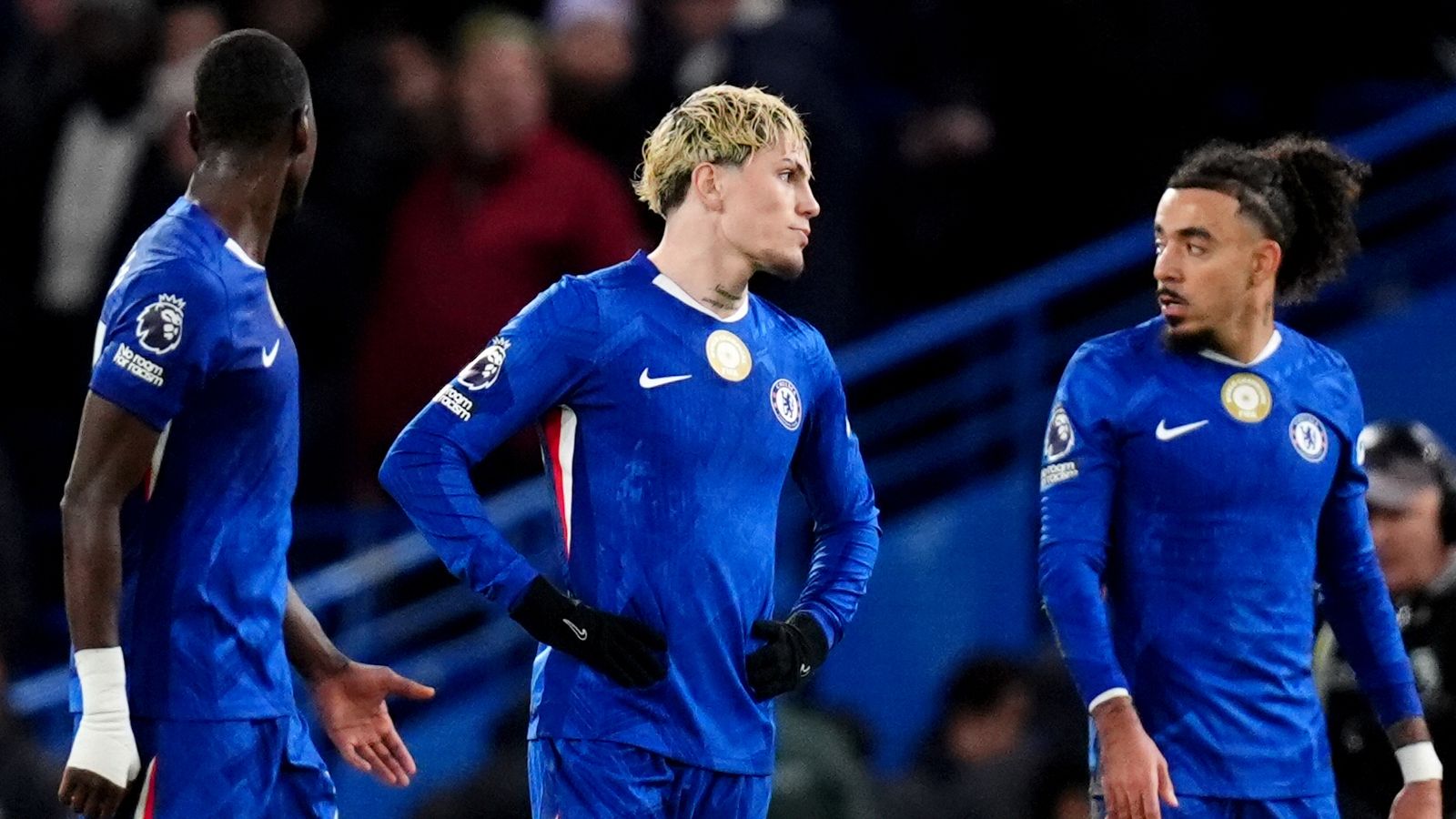 Chelsea's Alejandro Garnacho (centre) and Malo Gusto (right) appear dejected at half time