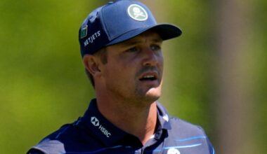 Bryson DeChambeau watches his tee shot on the 12th hole at The Masters
