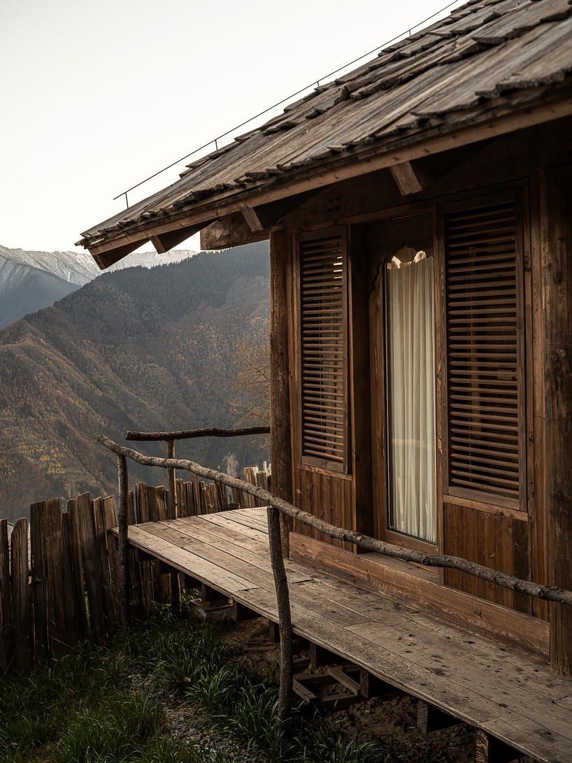 reclaimed timber reassembles a cluster of cabins into a mountain resort in china - 7