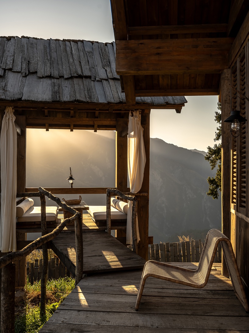 reclaimed timber reassembles a cluster of cabins into a mountain resort in china - 6