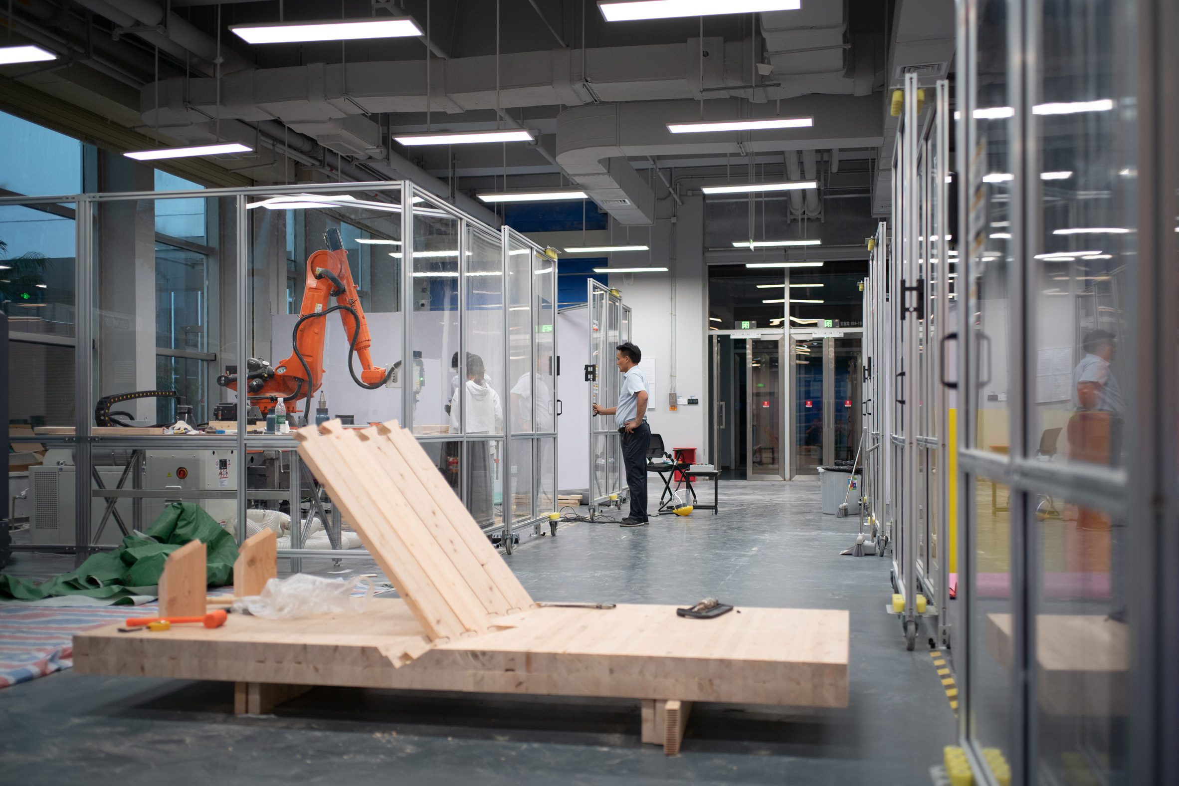a photograph of a person standing in a workshop