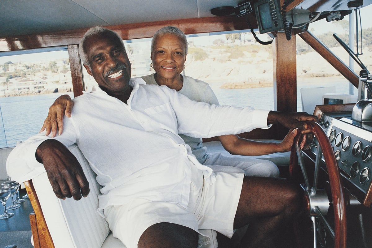 Happy retired couple on a boat.