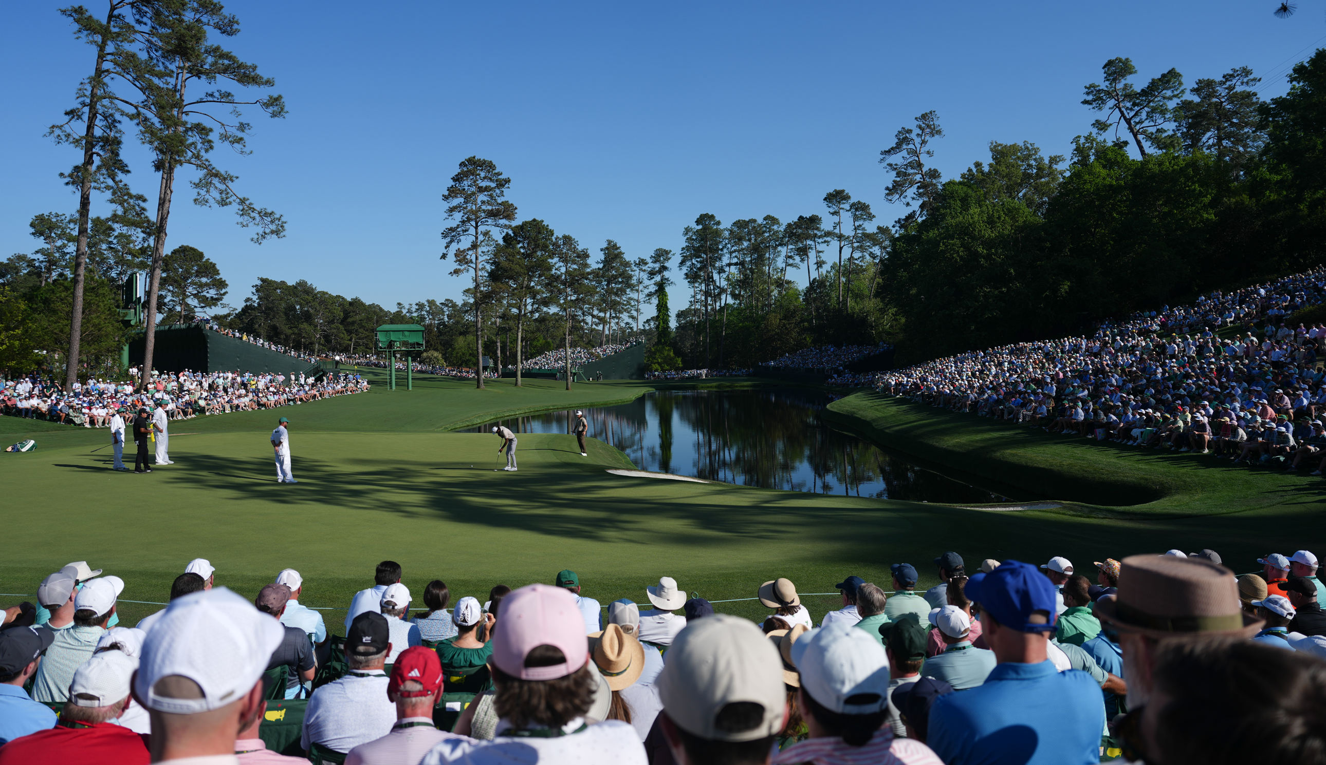 Patrons watch play around the 16th hole during the second round of Masters Tournament at Augusta National Golf Club