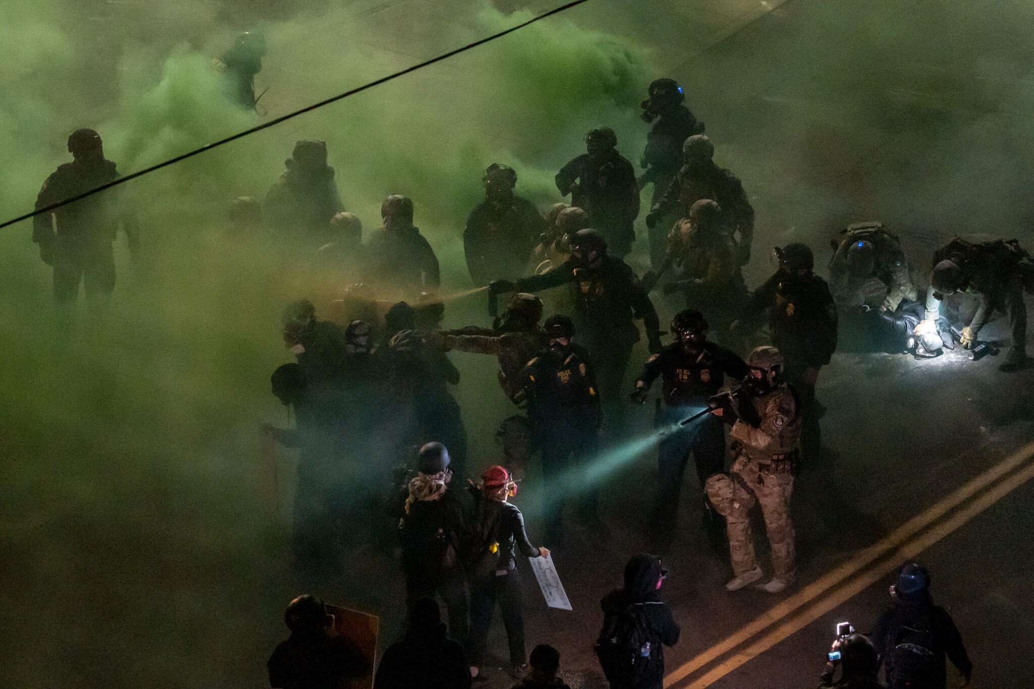 Jan Sonnenmair, “Portland Protests ICE.” Officers from the DHS and other federal agencies clash with demonstrators outside an ICE processing center. The intense summer protests centered on opposing the administration’s escalating mass-deportation agenda. Portland, Ore., June 24, 2025.