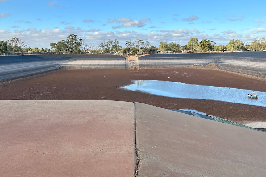 a dam with a small amount of water in the bottom