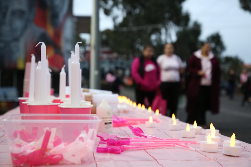Pink candles for a vigil.