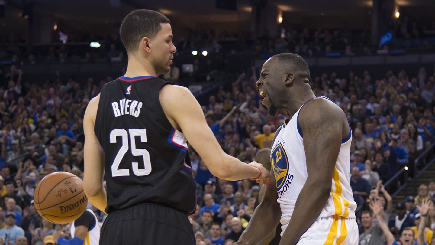 March 23, 2016; Oakland, CA, USA; Golden State Warriors forward Draymond Green (23) celebrates against Los Angeles Clippers guard Austin Rivers (25) during the third quarter at Oracle Arena. The Warriors defeated the Clippers 114-98. Mandatory Credit: Kyle Terada-Imagn Images