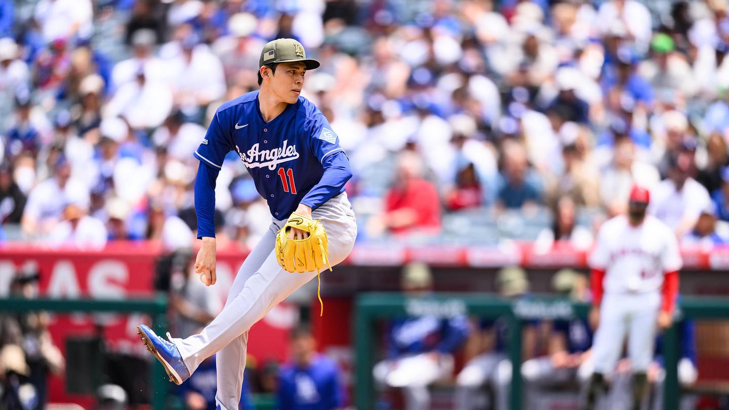 May 17, 2026; Anaheim, California, USA; Los Angeles Dodgers pitcher Roki Sasaki (11) delivers during the first inning against the Los Angeles Angels at Angel Stadium. Mandatory Credit: William Liang-Imagn Images