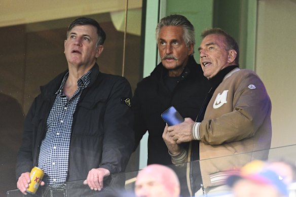 Kevin Costner (right) was a fascinated onlooker at the Gabba.