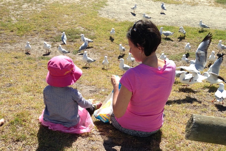 Kerrie and Pippa feed the birds
