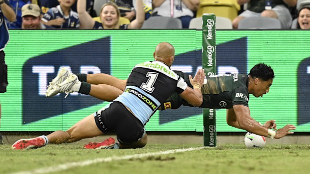 TOWNSVILLE, AUSTRALIA - APRIL 24: Murray Taulagi of the Cowboys scores a try during the round eight NRL match between North Queensland Cowboys and Cronulla Sharks at Qld Country Bank Stadium, on April 24, 2026, in Townsville, Australia. (Photo by Ian Hitchcock/Getty Images)