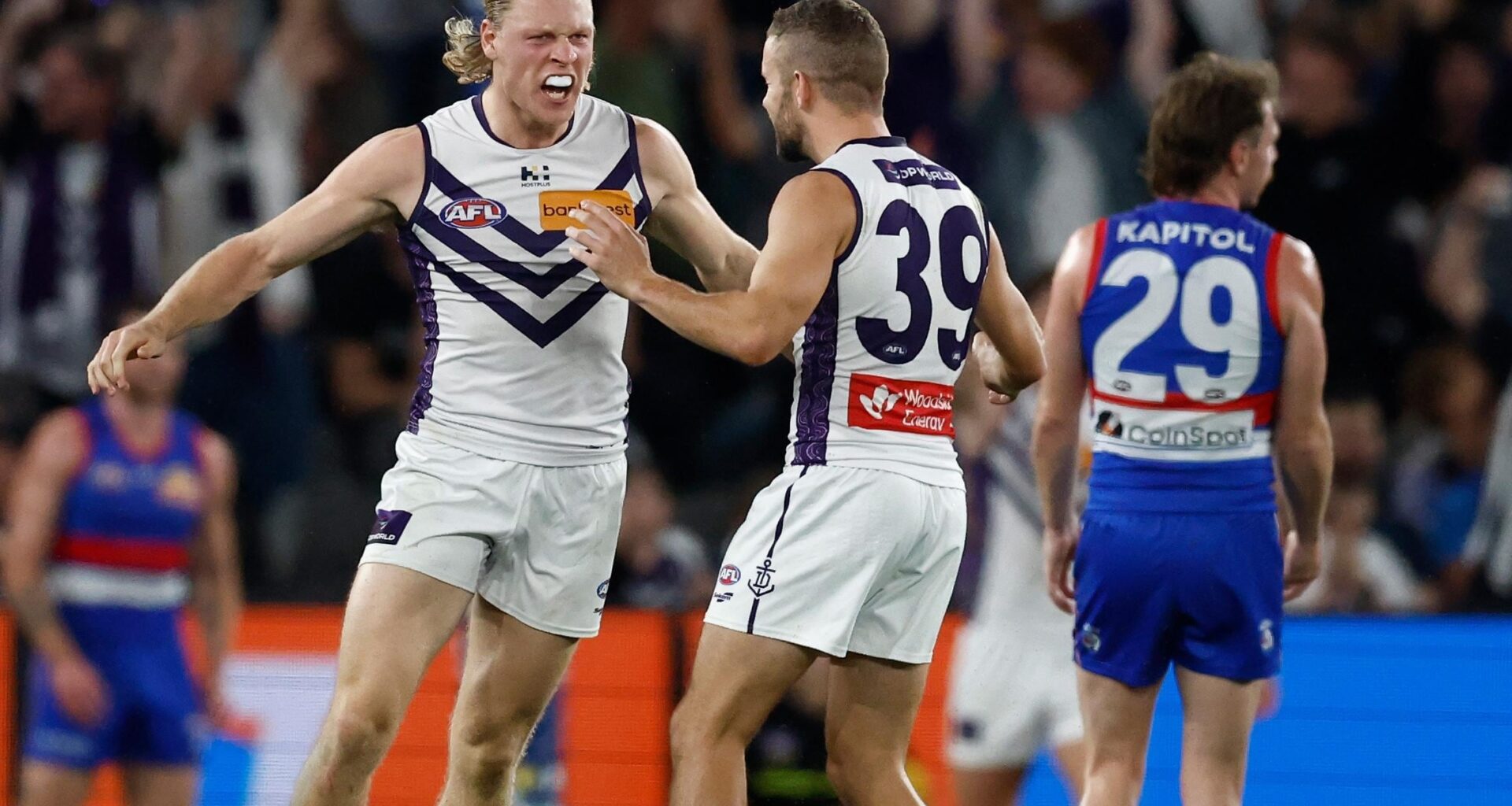 Classy Dockers hang on in a thriller against undermanned Dogs