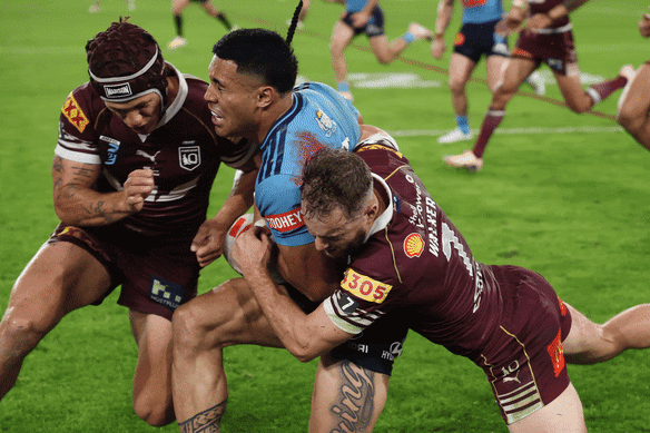 Kalyn Ponga makes contact with the head of Tolu Koula.