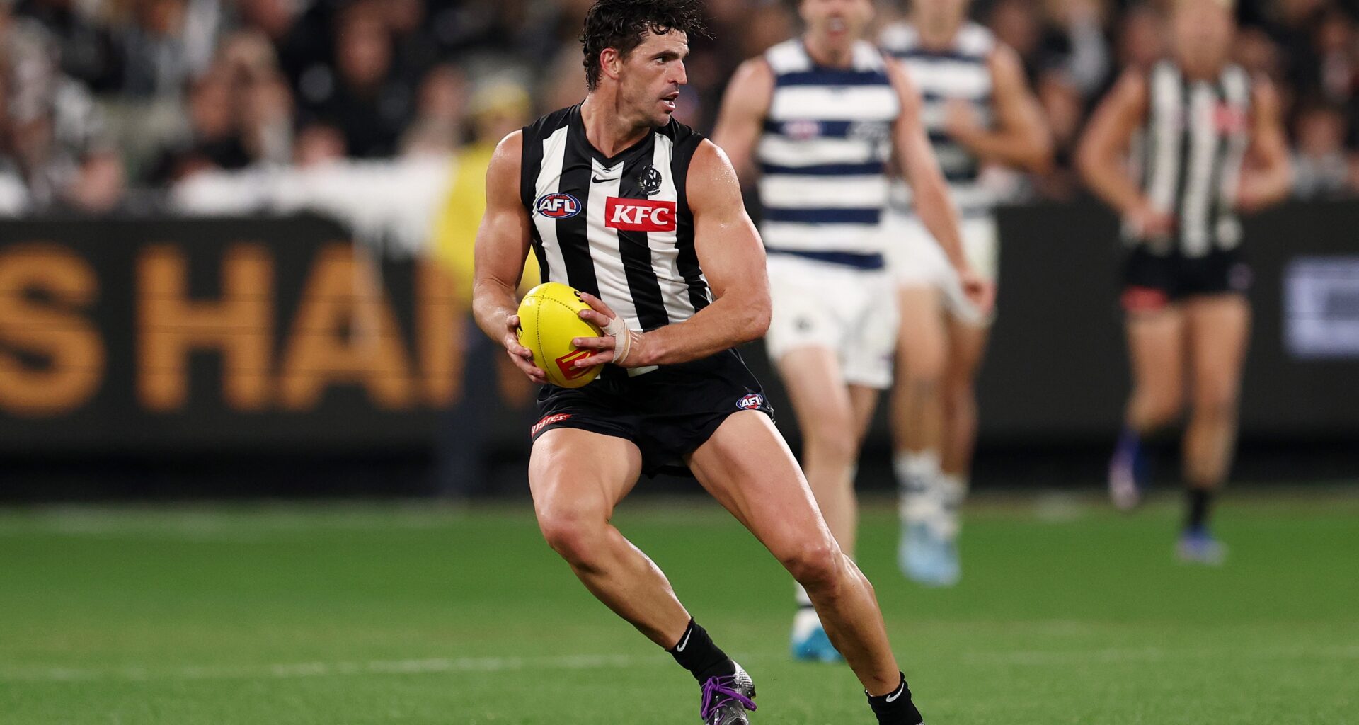 AFL Chairman Craig Drummond congratulates Scott Pendlebury