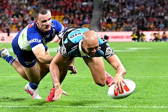 Will Kennedy scores for Cronulla.