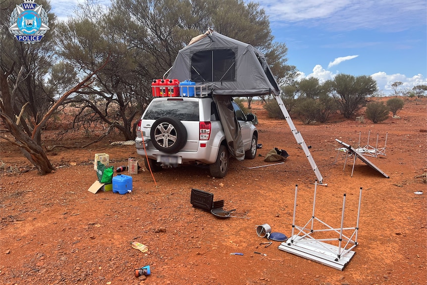 An abandoned campsite with a 4WD and tent.