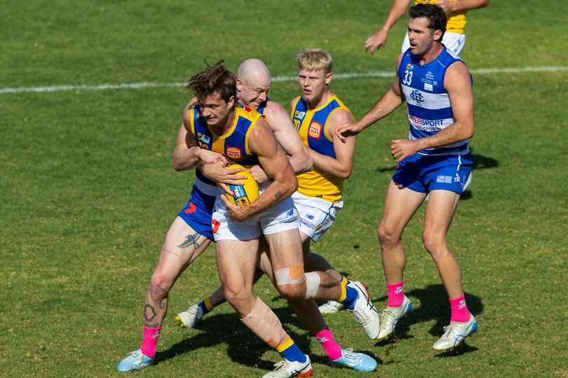 Harry Barnett caught in the tackle. Picture: Ross Swanborough