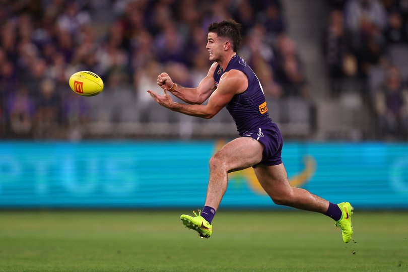 Andrew Brayshaw handballs.