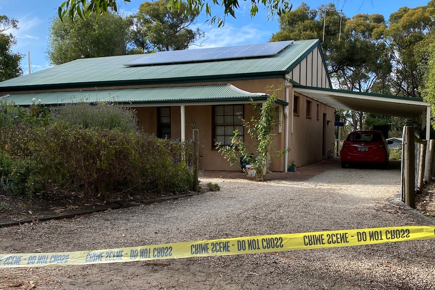 A house with police tape in front of it