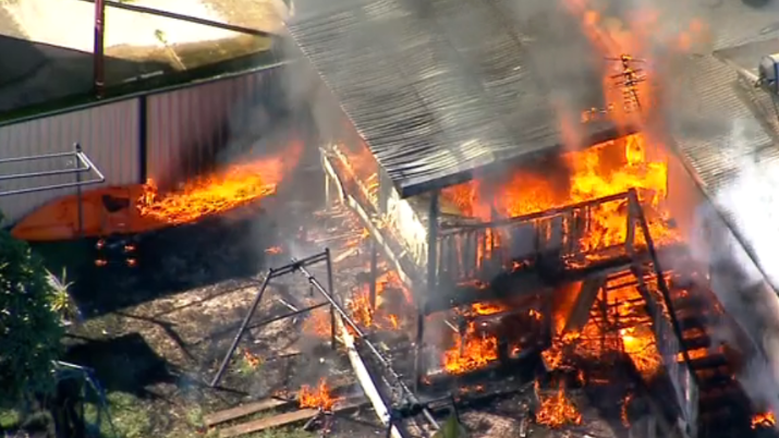 Whole street evacuated as at least two homes burn in a major fire in Clontarf, Brisbane