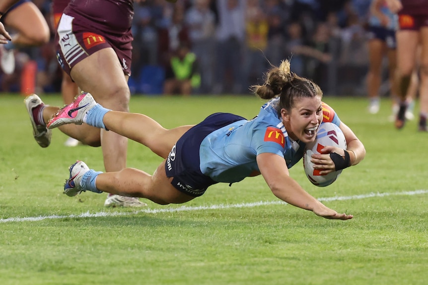 Jessica Sergis of the Blues scores a try during game one of the Women's State of Origin