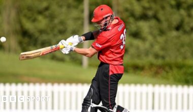 Matt Boyle batting for Canterbury Kings, wearing red shirt and dark trousers