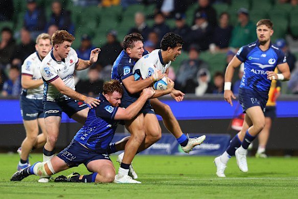 Joseph-Aukuso Suaalii is tackled by the Force’s Harry Johnson-Holmes and George Bridge on Saturday night.