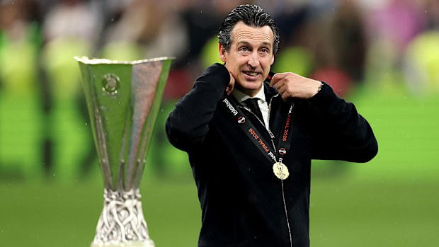 Unai Emery, manager of Aston Villa, adjusts his medal following the team's victory.
