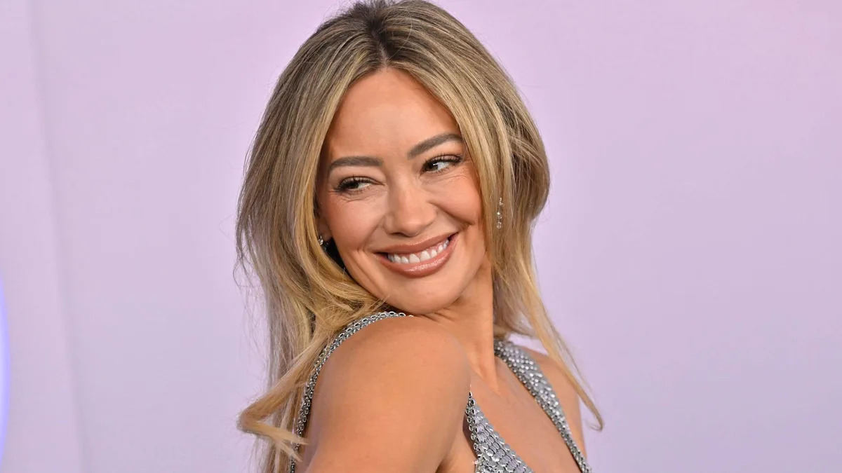 Hilary Duff looks phenomenal in plunging chainmail dress for show-stopping AMAs return