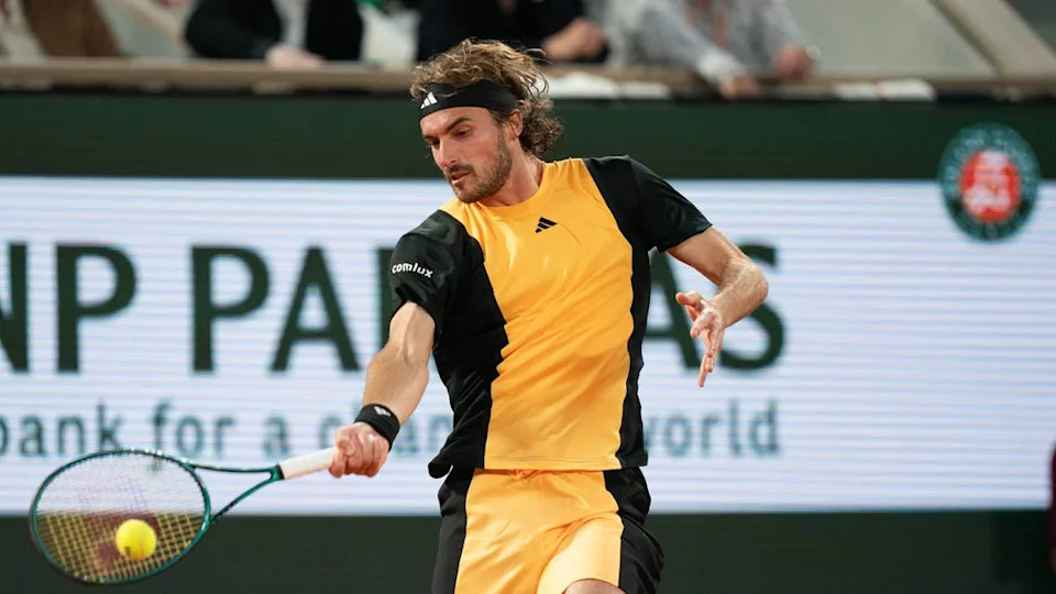 Jun 4, 2024; Paris, France; Stefanos Tsitsipas of Greece returns a shot during his match against Carlos Alcaraz of Spain on day 10 of Roland Garros at Stade Roland Garros. Mandatory Credit: Susan Mullane-USA TODAY Sports© Susan Mullane-Imagn Images.