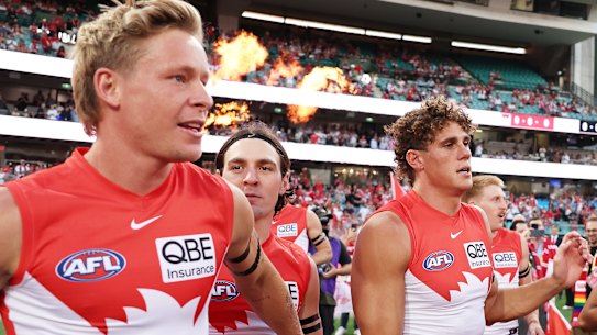 Swans academy product Isaac Heeney (left) runs onto the SCG.