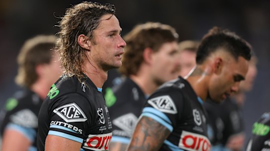 Cronulla players react after conceding another try.