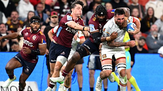 Josh Lord of the Chiefs attempts to break away at Suncorp Stadium.