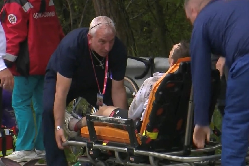 Jay Vine loaded onto a stretcher