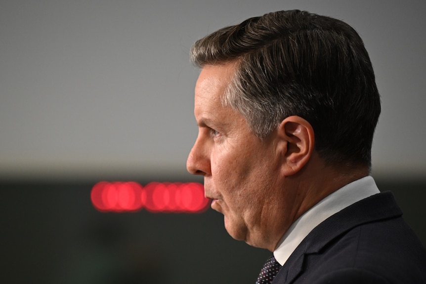 A man speaking at a press conference