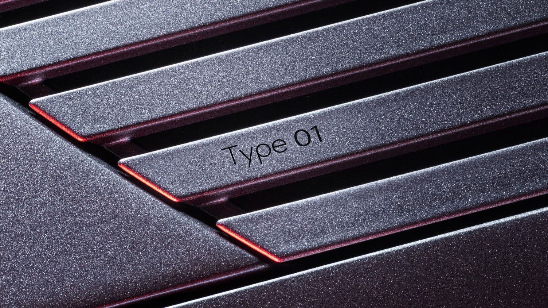 Jaguar Type 01 name badge on the bonnet strikethrough motif