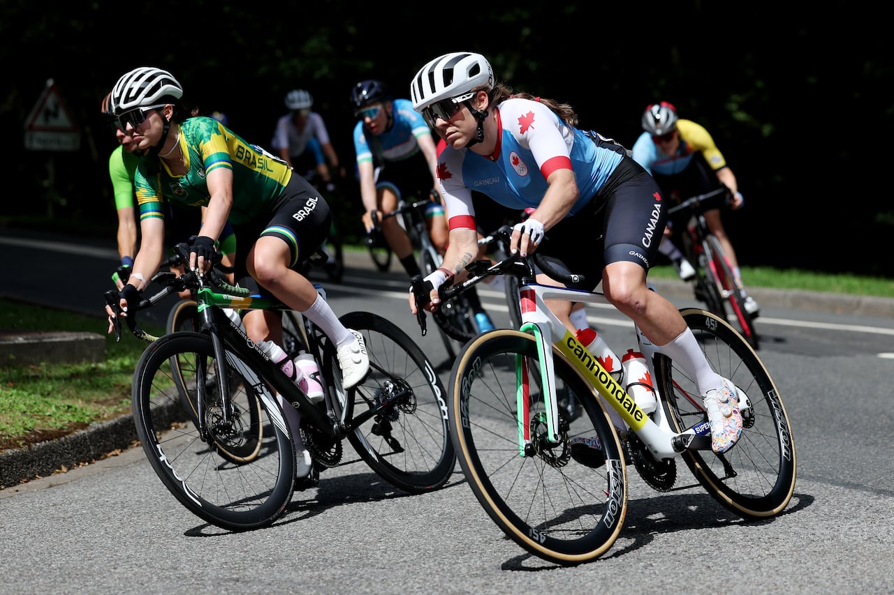 A female road cyclist representing Canada competes at the Olympics.