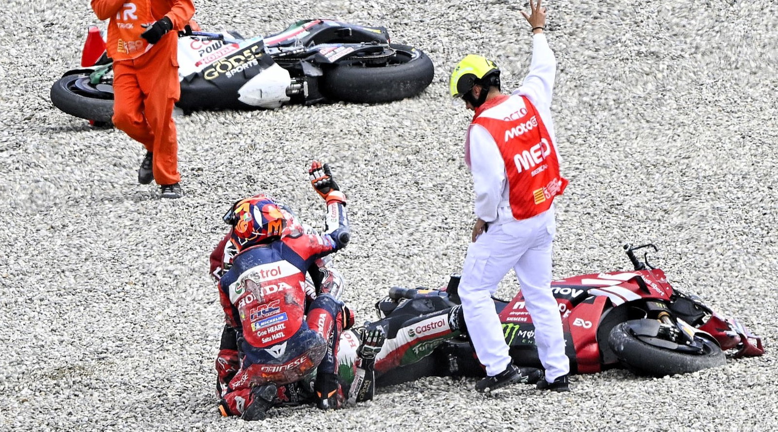 Luca Marini, Pecco Bagnaia help Johann Zarco after Turn 1 crash, 2026 Catalan MotoGP.