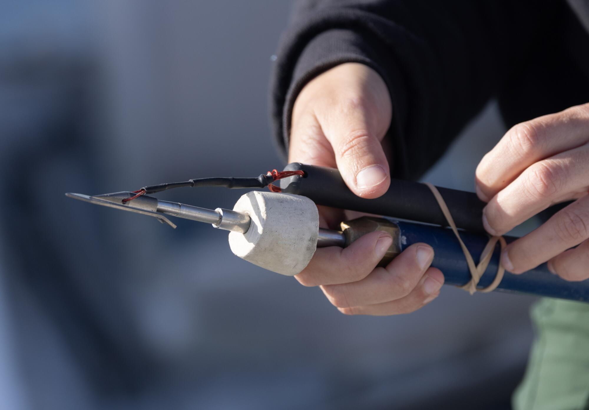 A harpoon is fitted with a tracking dart.