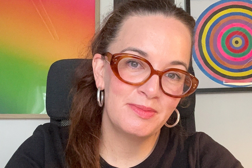 a woman smiling to camera