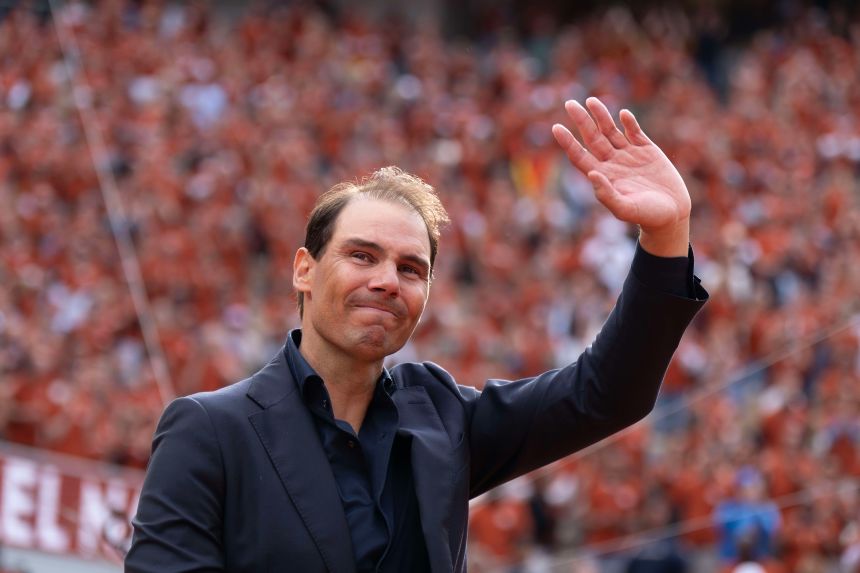 Nadal does a final walk around the court during a presentation ceremony paying tribute to his career at Roland Garros Stadium.