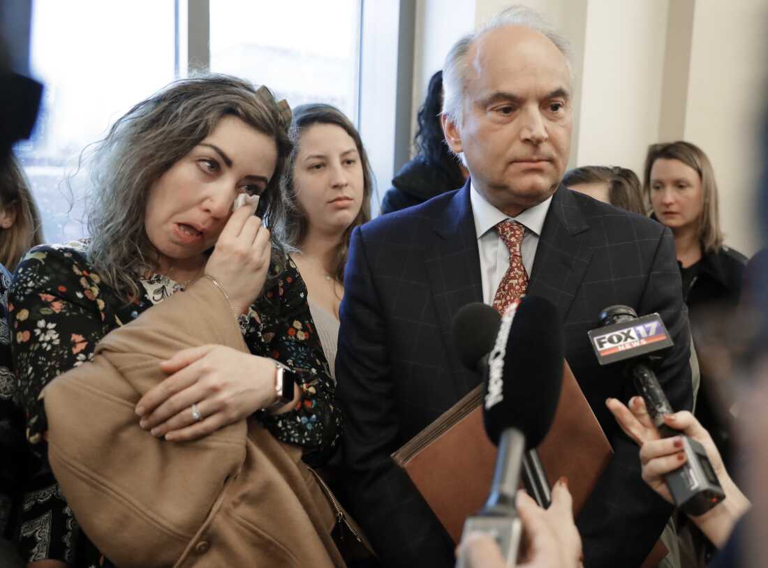 RaDonda Vaught and her attorney, Peter Strianse, talk with reporters after a court hearing on Feb. 20, 2019, in Nashville, Tenn.