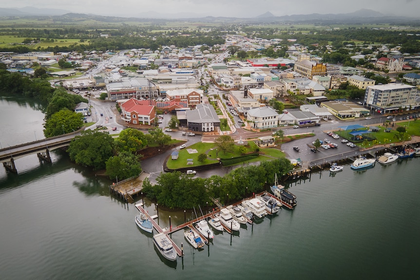 aerial picture of regional town situated next to river 