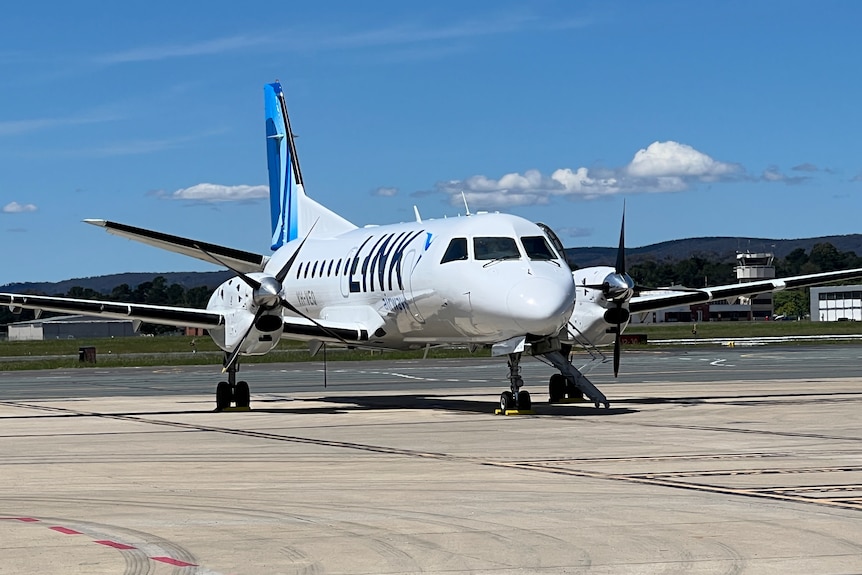 A small plane on the tarmac.