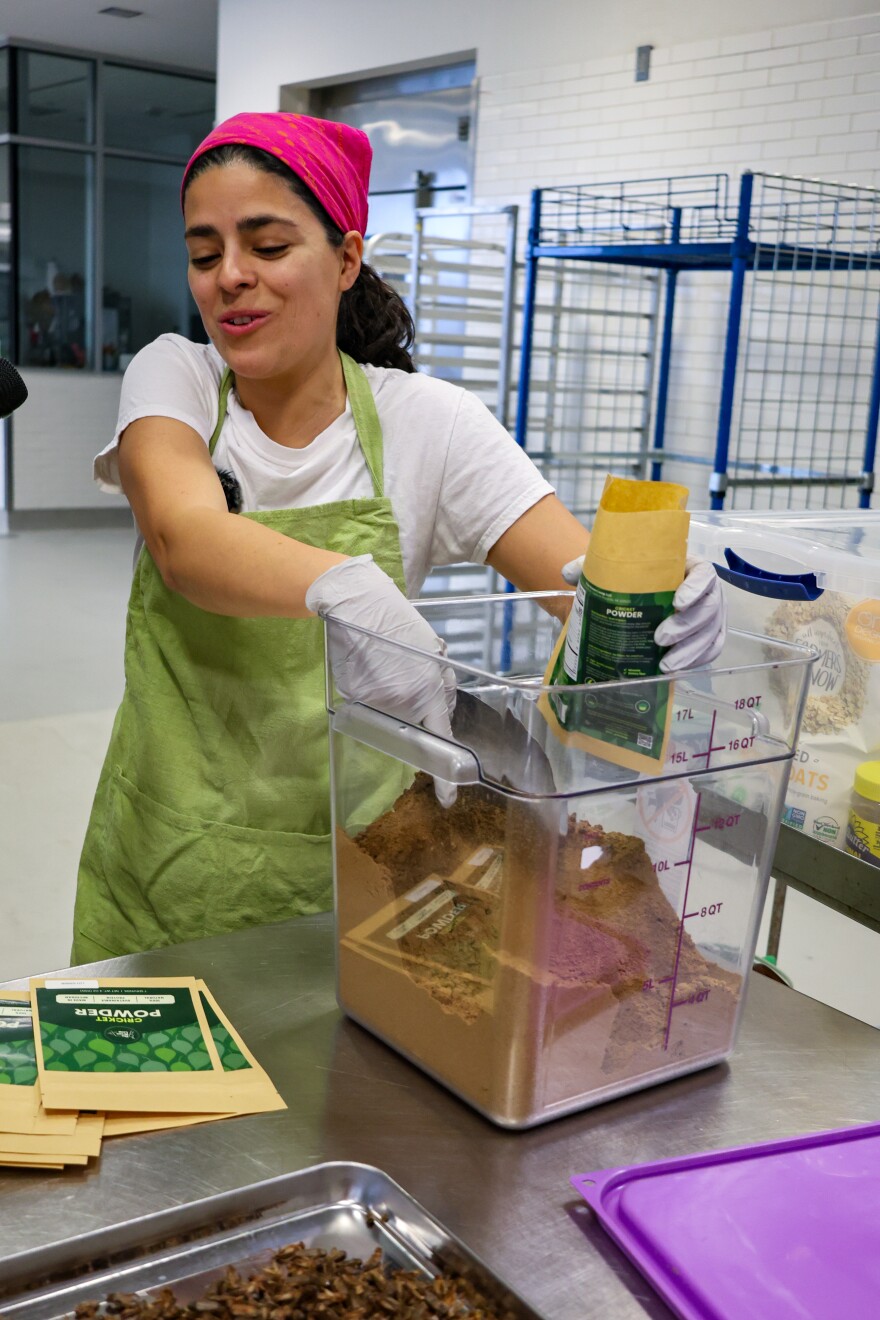 Montse Rosales Osoria assembles a package of "The Green Leap," a cricket-based protein powder.