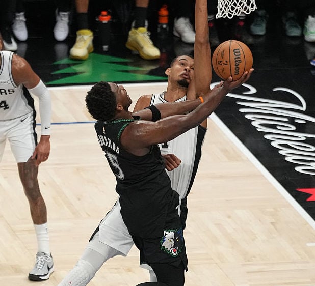 Anthony Edwards drives to the rim against Victor Wembanyama.