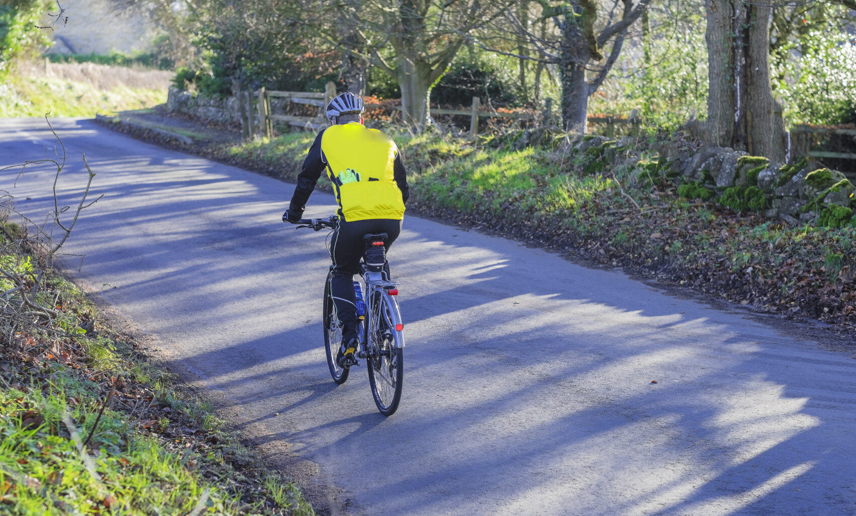 Man on bike on country road